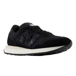 Trampki Damskie Skóra 237. Czarne trampki i tenisówki damskie New Balance, bez wzorów, z gumy, bez zapięcia. Za 587.99 zł.