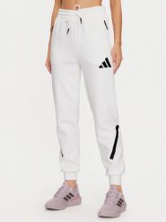Adidas Spodnie dresowe Z.N.E. JE7843 Biały Regular Fit. Białe spodnie dresowe damskie Adidas, xl, bez wzorów, z bawełny. Za 279.99 zł.