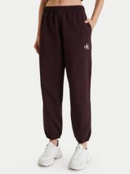 Calvin Klein Jeans Spodnie dresowe Monologo LV047B235G Brązowy Regular Fit. Brązowe jeansy damskie Calvin Klein Jeans. Za 379.99 zł.
