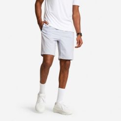 Spodenki fitness cardio męskie Domyos. Niebieskie krótkie spodenki sportowe męskie DOMYOS, l, bez wzorów, z elastanu, na fitness i siłownię. Za 49.99 zł.