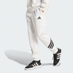 Spodnie Future Icons z 3 paskami. Białe buty sportowe męskie Adidas, l, bez wzorów, z bawełny, na fitness i siłownię. Za 241.50 zł.
