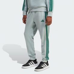 Spodnie Essential 3-Stripes French Terry. Zielone spodnie sportowe męskie Adidas, bez wzorów, z materiału. Za 219.00 zł.