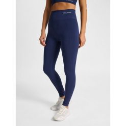 Rajstopy damskie z wysoką talią Hummel hmltif. Fioletowe legginsy damskie Hummel, bez wzorów, na fitness i siłownię. Za 152.50 zł.