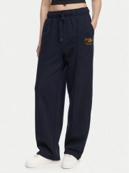 Tommy Hilfiger Spodnie dresowe Logo Exaggerated Seam WW0WW50783 Granatowy Relaxed Fit. Niebieskie spodnie dresowe damskie Tommy Hilfiger, s, bez wzorów, z bawełny. Za 649.99 zł.