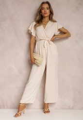 Jasnobeżowy Kombinezon z Wiskozy Zotolio. Brązowe sukienki damskie Renee, na imprezę, na lato, m, bez wzorów, z materiału, eleganckie, bez kołnierzyka, bez ramiączek, maxi, kopertowe. Za 49.99 zł.