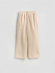 Spodnie z zakładkami - beżowy. Brązowe spodnie materiałowe damskie Reserved, l, bez wzorów, z bawełny. Za 119.99 zł.