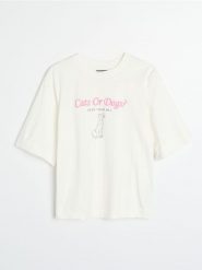 Bawełniana koszulka z nadrukiem Disney - kremowy. Białe t-shirty damskie Sinsay, l, bez wzorów, z bawełny, bez kołnierzyka. Za 29.99 zł.