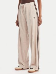 Adidas Spodnie dresowe Terry Towel Firebird KQ6661 Beżowy Loose Fit. Brązowe spodnie dresowe damskie Adidas, xs, bez wzorów, z bawełny. Za 339.99 zł.