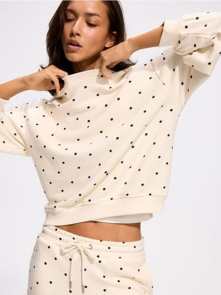 Bluza z bawełną - złamana biel. Bluzy damskie Reserved, l, bez wzorów, z bawełny, bez kaptura. Za 119.99 zł.