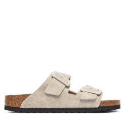 Klapki Birkenstock. Białe klapki damskie Birkenstock, bez wzorów, bez obcasa. Za 629.99 zł.