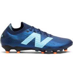 Korki męskie New Balance TEKELA PRO FG V4+ ST1FLN45 – granatowe. Niebieskie buty sportowe męskie New Balance, z gumy, bez zapięcia, do piłki nożnej. Za 529.99 zł.