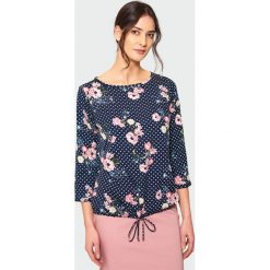 Elegancka bluzka z troczkiem. Bluzki damskie marki Greenpoint. Za 39.99 zł.