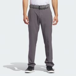 Spodnie Ultimate365 Tapered Golf. Szare spodnie sportowe męskie Adidas, l, bez wzorów, z elastanu, na golfa. Za 334.40 zł.