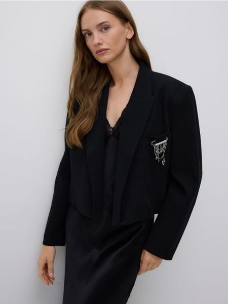 Marynarka z ozdobną aplikacją - czarny. Czarne żakiety damskie Reserved, l, z aplikacjami, z bawełny. Za 249.99 zł.