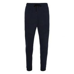 Spodnie do biegania Protest Nxgguss. Niebieskie spodnie sportowe męskie Protest, bez wzorów, do biegania. Za 269.99 zł.