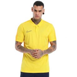 Koszulka sportowa męska Nike Drifit Academy. Niebieskie koszulki polo męskie Nike, m, bez wzorów, z materiału, bez kołnierzyka, bez ramiączek, na fitness i siłownię, dri-fit (nike). Za 179.99 zł.