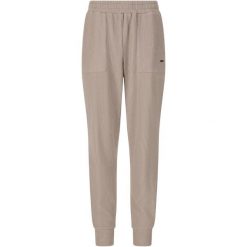 Damskie spodnie dresowe Athlecia Reiley. Brązowe spodnie sportowe damskie Athlecia, bez wzorów, z dresówki, na fitness i siłownię. Za 251.50 zł.