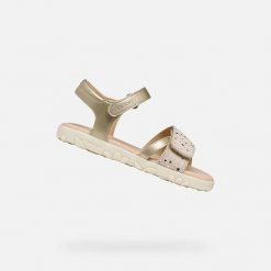 Sandały GEOX J SANDAL HAITI Złoty. Żółte sandały damskie Geox, bez wzorów, z syntetyku, bez obcasa, bez zapięcia. Za 225.99 zł.