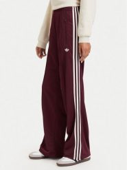 Adidas Spodnie dresowe Adicolor Classic Firebird KA7743 Brązowy Loose Fit. Brązowe spodnie dresowe damskie Adidas, s, bez wzorów, z dresówki. Za 299.99 zł.