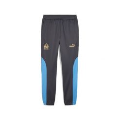Męskie spodnie Olympique de Marseille ftblNRGY+ PUMA. Brązowe spodnie sportowe męskie Puma, m, bez wzorów, z dresówki, do piłki nożnej. Za 284.00 zł.