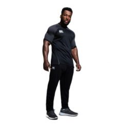 Dopasowane spodnie dresowe z elastycznego poliestru Canterbury. Czarne spodnie sportowe męskie CANTERBURY, bez wzorów, z dresówki, na fitness i siłownię. Za 346.50 zł.