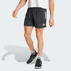 Szorty Own The Run. Czarne krótkie spodenki sportowe męskie Adidas, l, bez wzorów, z materiału, do biegania. Za 179.00 zł.