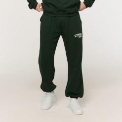Spodnie męskie fitness oversize ze sznurkiem Varsity zielone. Zielone spodnie sportowe męskie GYMBEAM, l, bez wzorów, z bawełny, na fitness i siłownię. Za 126.90 zł.
