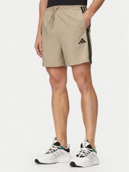 Adidas Szorty sportowe Essentials 3-Stripes Chelsea KD4889 Zielony Regular Fit. Zielone krótkie spodenki sportowe męskie Adidas, m, bez wzorów, z syntetyku. Za 119.99 zł.
