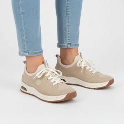 Półbuty damskie Rieker, cholewka ze skóry ekologicznej sportowa sylwetka wsuwane miękka amortyzowana podeszwa, beżowe, 44562-62. Brązowe obuwie sportowe damskie Rieker, bez wzorów, ze skóry ekologicznej, eleganckie, bez obcasa, na płaskiej podeszwie, bez zapięcia. Za 369.00 zł.