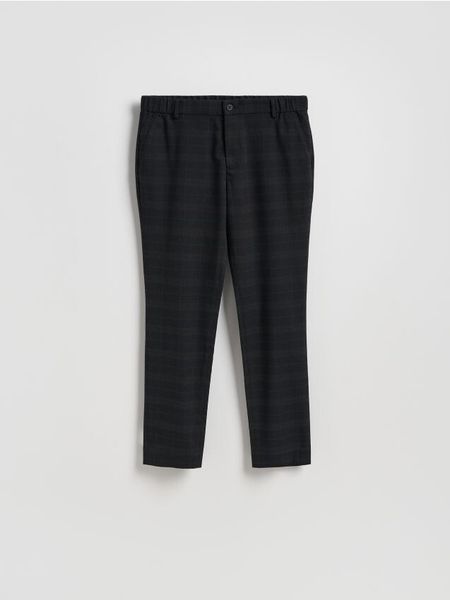Spodnie chino slim w kratę - czarny. Czarne spodnie materiałowe męskie Reserved, l, bez wzorów, z tkaniny. W wyprzedaży za 69.99 zł.