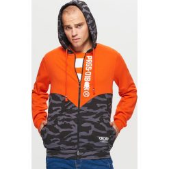 Zapinana bluza z kapturem kolekcja PROGRESS - Pomarańczowy. Bluzy męskie marki KALENJI. W wyprzedaży za 69.99 zł.