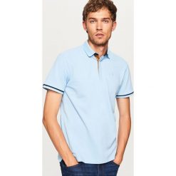 Koszulka polo - Niebieski. Niebieskie koszulki polo męskie Reserved. Za 79.99 zł.