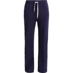 Tiger of Sweden Jeans RADIO Spodnie treningowe maritineblue. Spodnie sportowe damskie Tiger of Sweden Jeans. W wyprzedaży za 431.40 zł.
