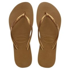 Klapki damskie Havaianas Slim. Brązowe klapki damskie Havaianas, bez wzorów, z materiału, eleganckie, bez obcasa. Za 138.00 zł.