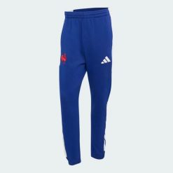 Spodnie Francja Rugby Travel. Niebieskie spodnie sportowe męskie Adidas, l, bez wzorów, z bawełny. Za 369.00 zł.