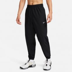 Spodnie treningowe męskie Nike FB7497010BLACKBLACK. Czarne spodnie sportowe męskie Nike, l, bez wzorów, z dresówki, do biegania. Za 419.00 zł.