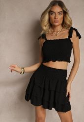 Czarny Komplet Dopasowany Top z Wiązaniem i Spódnica o Rozkloszowanym Kroju Evianea. Czarne spódnice damskie Renee, na lato, m, bez wzorów, eleganckie, dopasowane. Za 49.99 zł.