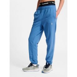 Damskie spodnie dresowe Hummel Pulse. Niebieskie obuwie sportowe damskie Hummel, bez wzorów, z dresówki, na fitness i siłownię. Za 170.00 zł.