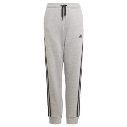 Spodnie dziecięce adidas Essentials 3-Bandes. Czarne spodnie materiałowe dla dziewczynek Adidas, bez wzorów, do biegania. Za 106.90 zł.