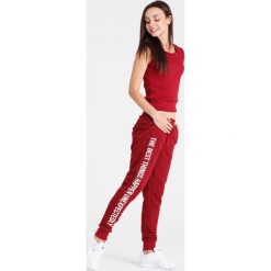 Naoko - Spodnie The Best Things Rouge. Spodnie sportowe damskie marki WED'ZE. W wyprzedaży za 129.90 zł.