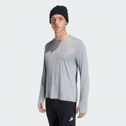 Koszulka adi365 Running Essentials Longsleeve. Szare buty sportowe męskie Adidas, bez wzorów, bez kołnierzyka, bez ramiączek, do biegania, climacool (adidas). Za 149.00 zł.