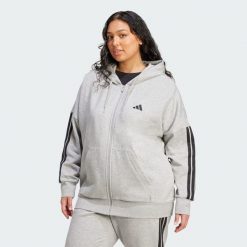 Bluza Essentials 3-Stripes Full-Zip Fleece Hoodie (Plus Size). Czarne bluzy sportowe damskie Adidas, m, bez wzorów, z materiału, z kapturem, na fitness i siłownię. W wyprzedaży za 194.25 zł.