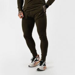 Spodnie męskie fitness slim zielone Urban. Zielone spodnie sportowe męskie GYMBEAM, l, bez wzorów, z bawełny, na fitness i siłownię. Za 115.90 zł.