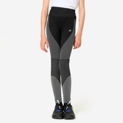 Legginsy fitness dziecięce Domyos. Białe legginsy dla dziewczynek Decathlon, bez wzorów, z materiału. Za 49.99 zł.