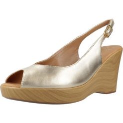 Sandały UNISA RACHEL LMT Złoty. Żółte sandały damskie Unisa, bez wzorów, ze skóry, bez obcasa, bez zapięcia. Za 450.99 zł.