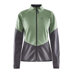 Damska wiatrówka Craft Glide. Zielone kurtki sportowe damskie Craft, bez wzorów, z softshellu, bez kaptura, na fitness i siłownię. W wyprzedaży za 279.00 zł.