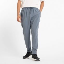 Spodnie męskie New Balance MP51904GT – szare. Szare spodnie sportowe męskie New Balance, m, bez wzorów, z materiału, na fitness i siłownię. Za 199.99 zł.