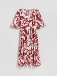 Wzorzysta sukienka midi - czerwony. Czerwone sukienki damskie Reserved, l, bez wzorów, z wiskozy, bez kołnierzyka, bez ramiączek, midi, rozkloszowane. Za 139.99 zł.