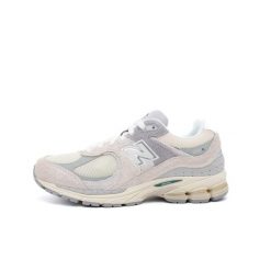 Buty New Balance 2002R beżowe męskie. Brązowe buty sportowe męskie New Balance, z materiału, bez zapięcia, do biegania. Za 614.00 zł.