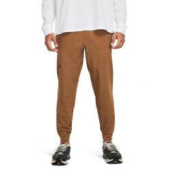 Spodnie dresowe męskie Under Armour UNSTOPPABLE JOGGERS. Brązowe buty sportowe męskie Under Armour, m, bez wzorów, z dresówki, na fitness i siłownię. Za 279.99 zł.